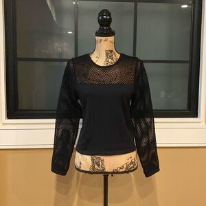 Black sweater with long sleeves. The top/shoulders have an open knit. Sz Small.